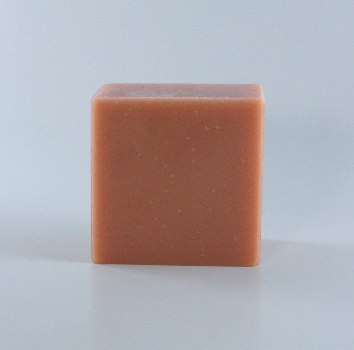 Hippie Hollow Patchouli Soap with a blush pink finish and clean rectangular shape photographed from the front on a neutral background.