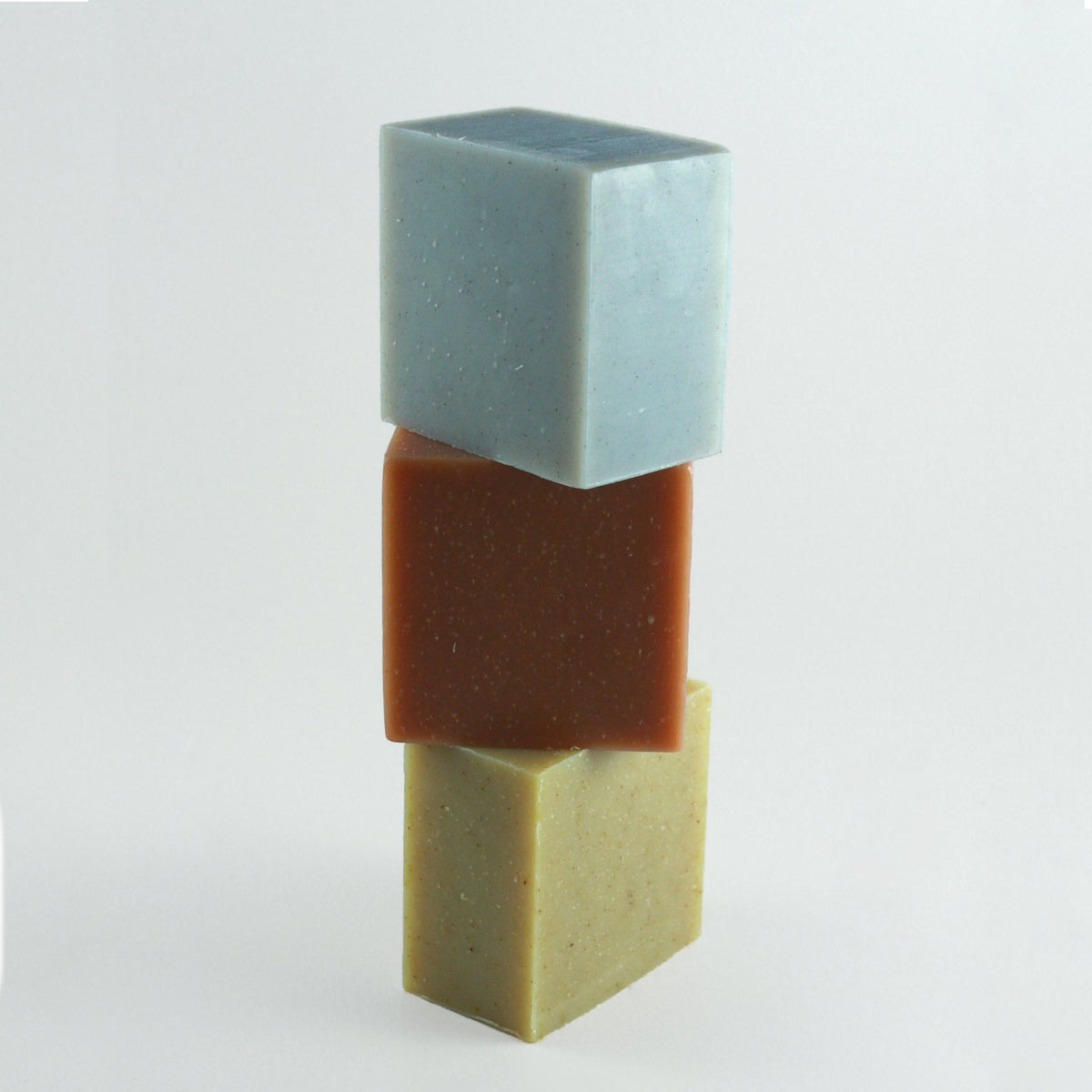 Three stacked rectangular bars of soap.