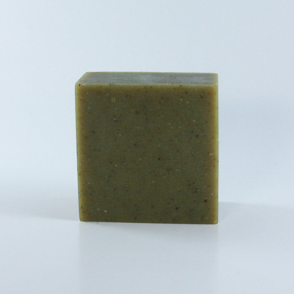 Garden Grove Rosemary Mint Soap with a olive green speckled texture and clean rectangular shape photographed from the front.