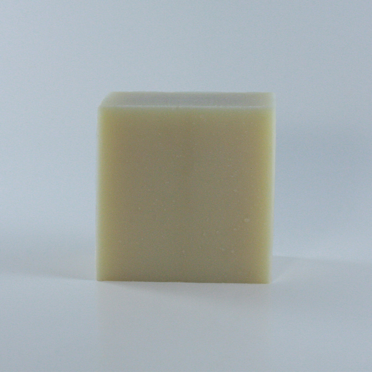 Simple Life Unscented All-Purpose Soap with a creamy texture and off-white finish and clean rectangular shape photographed from an angle on a neutral background.